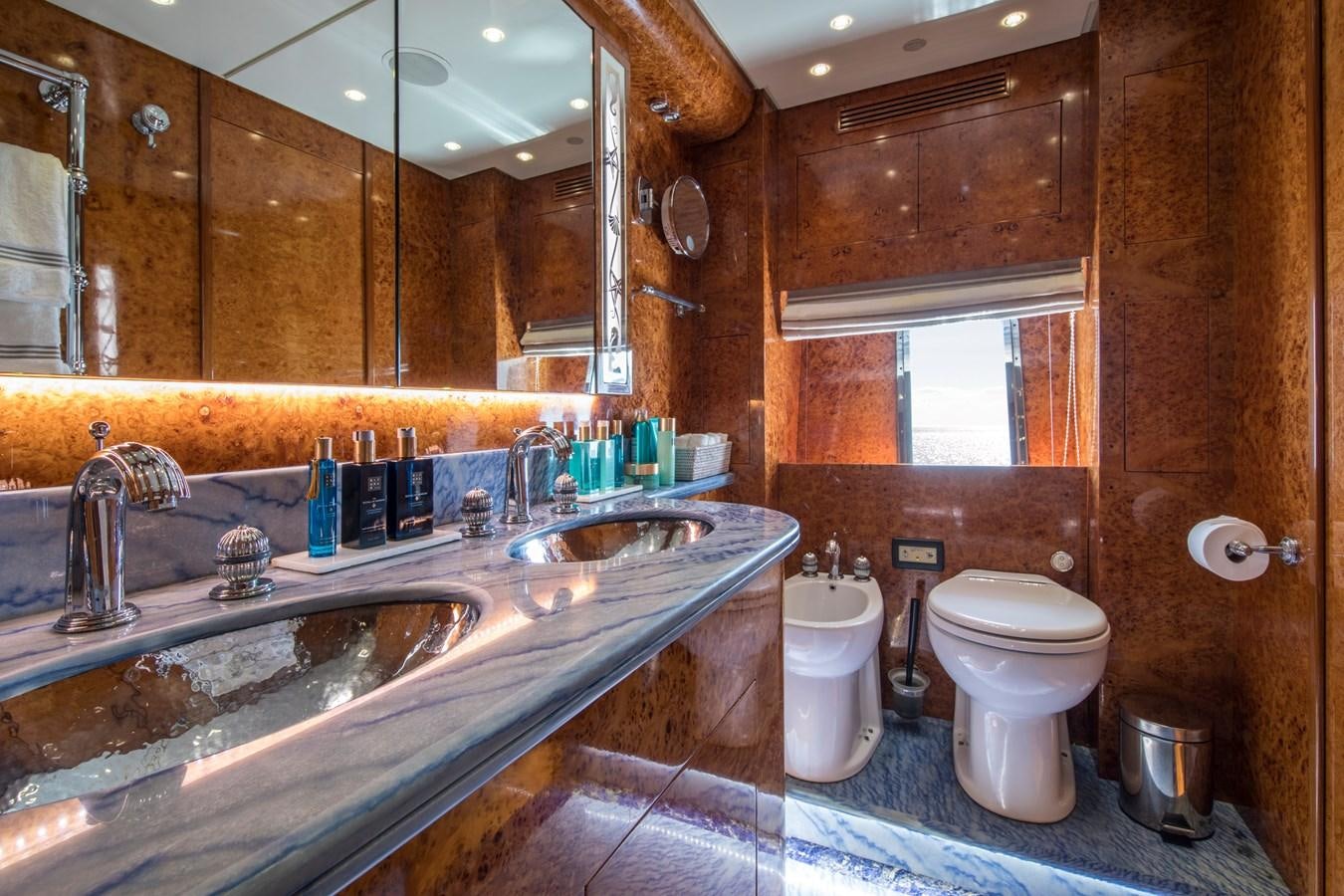 a bathroom with a sink toilet and a bathtub aboard CITA Yacht for Sale