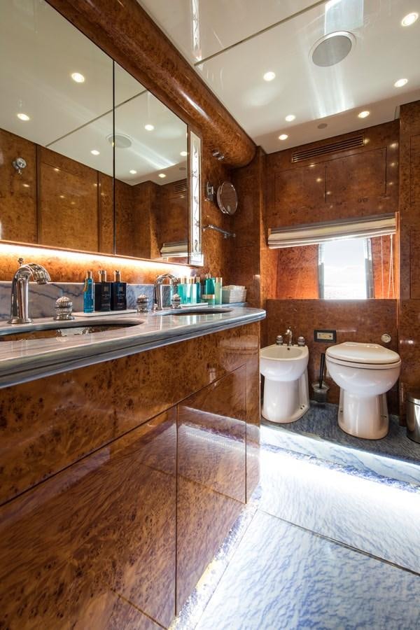a bathroom with a sink toilet and a mirror aboard CITA Yacht for Sale