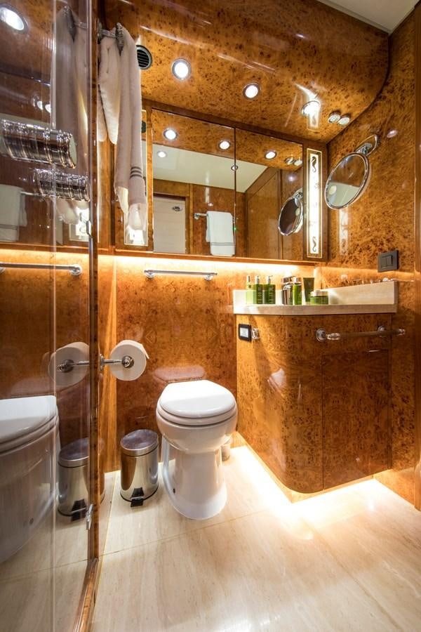 a bathroom with a glass shower aboard CITA Yacht for Sale