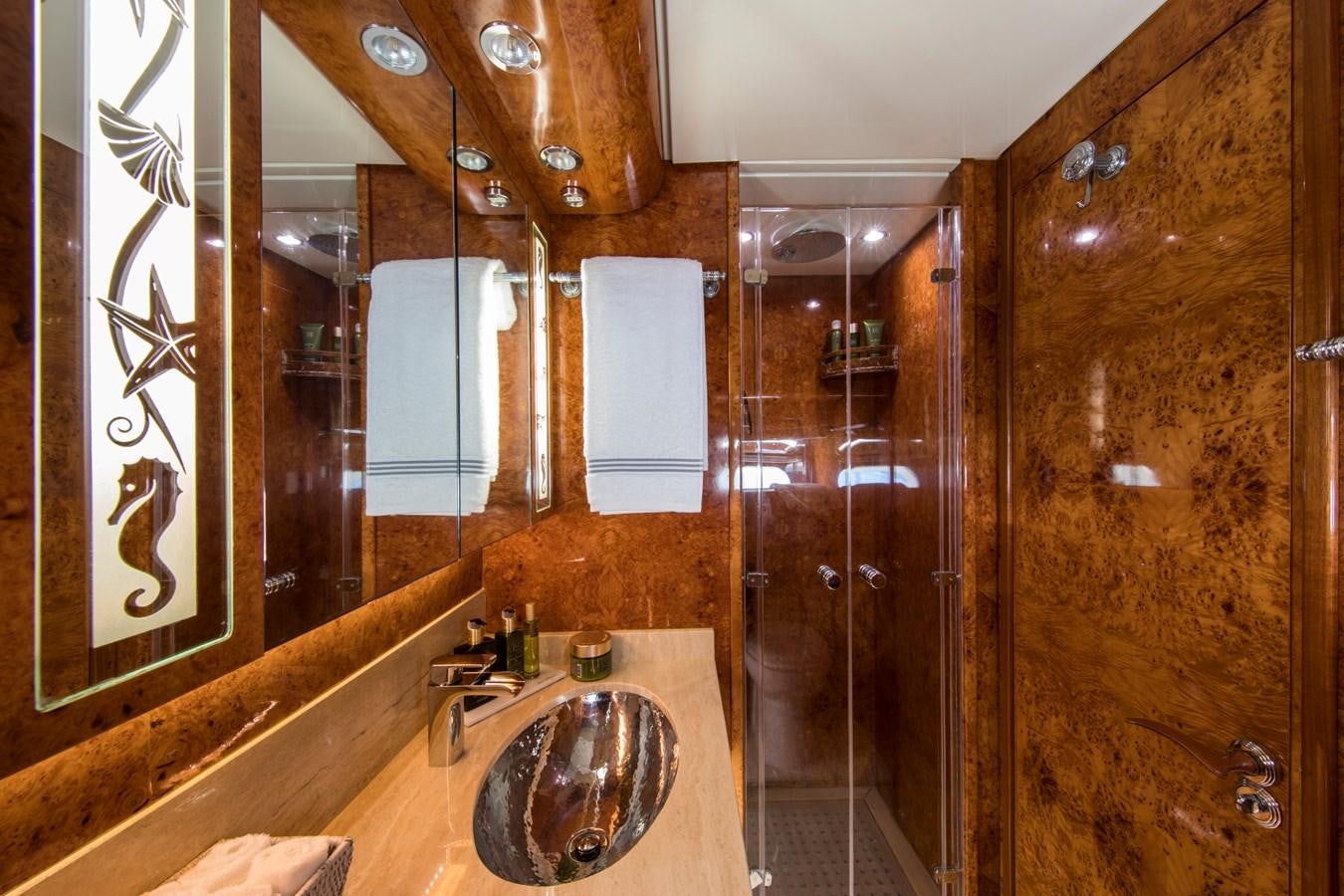 a bathroom with a marble countertop aboard CITA Yacht for Sale