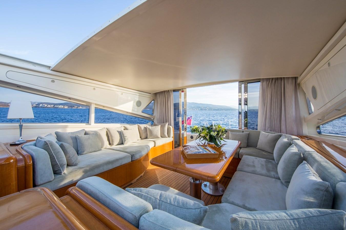 a living room with a large window aboard CITA Yacht for Sale