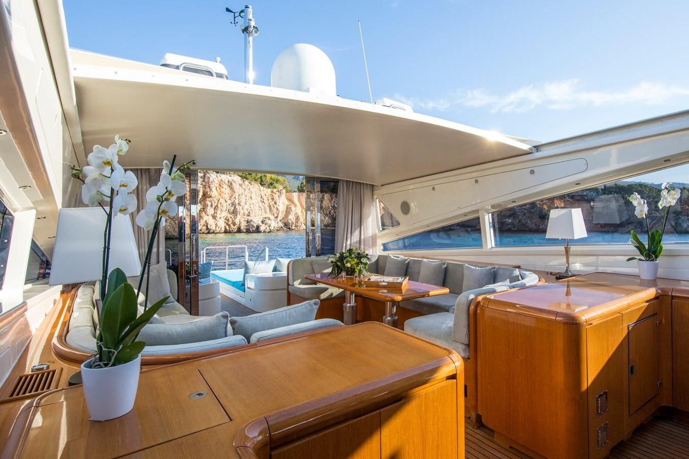 a living room with a large window aboard CITA Yacht for Sale
