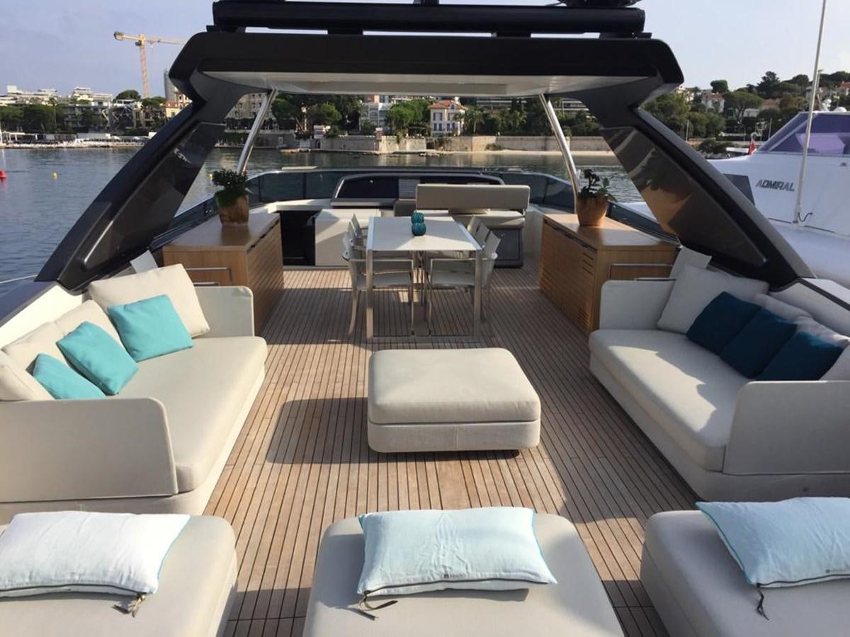 a boat with a deck and chairs aboard TAIJI Yacht for Sale