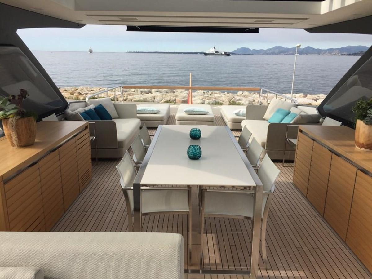 a room with a table and chairs aboard TAIJI Yacht for Sale