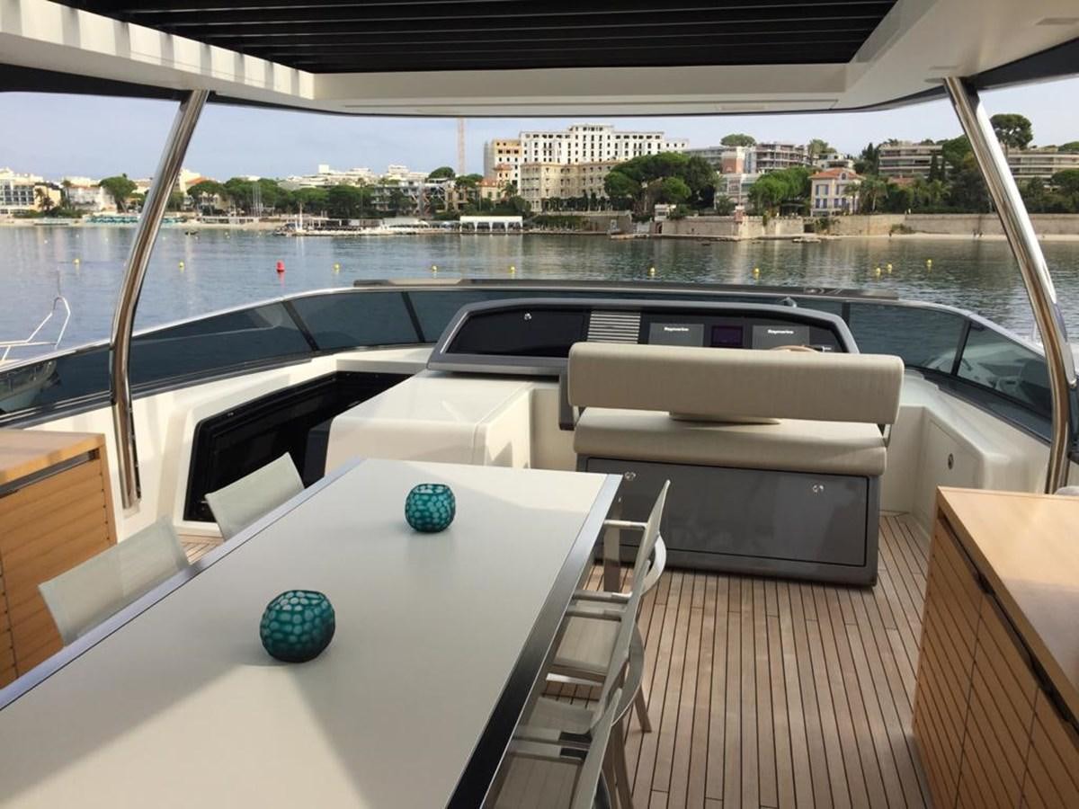 a room with a table and chairs aboard TAIJI Yacht for Sale