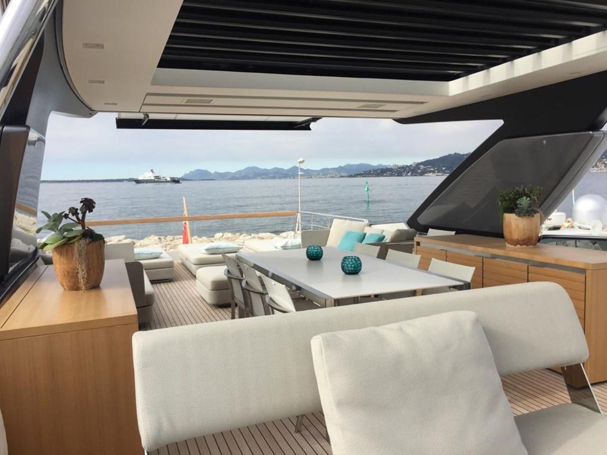 a room with a table and chairs aboard TAIJI Yacht for Sale