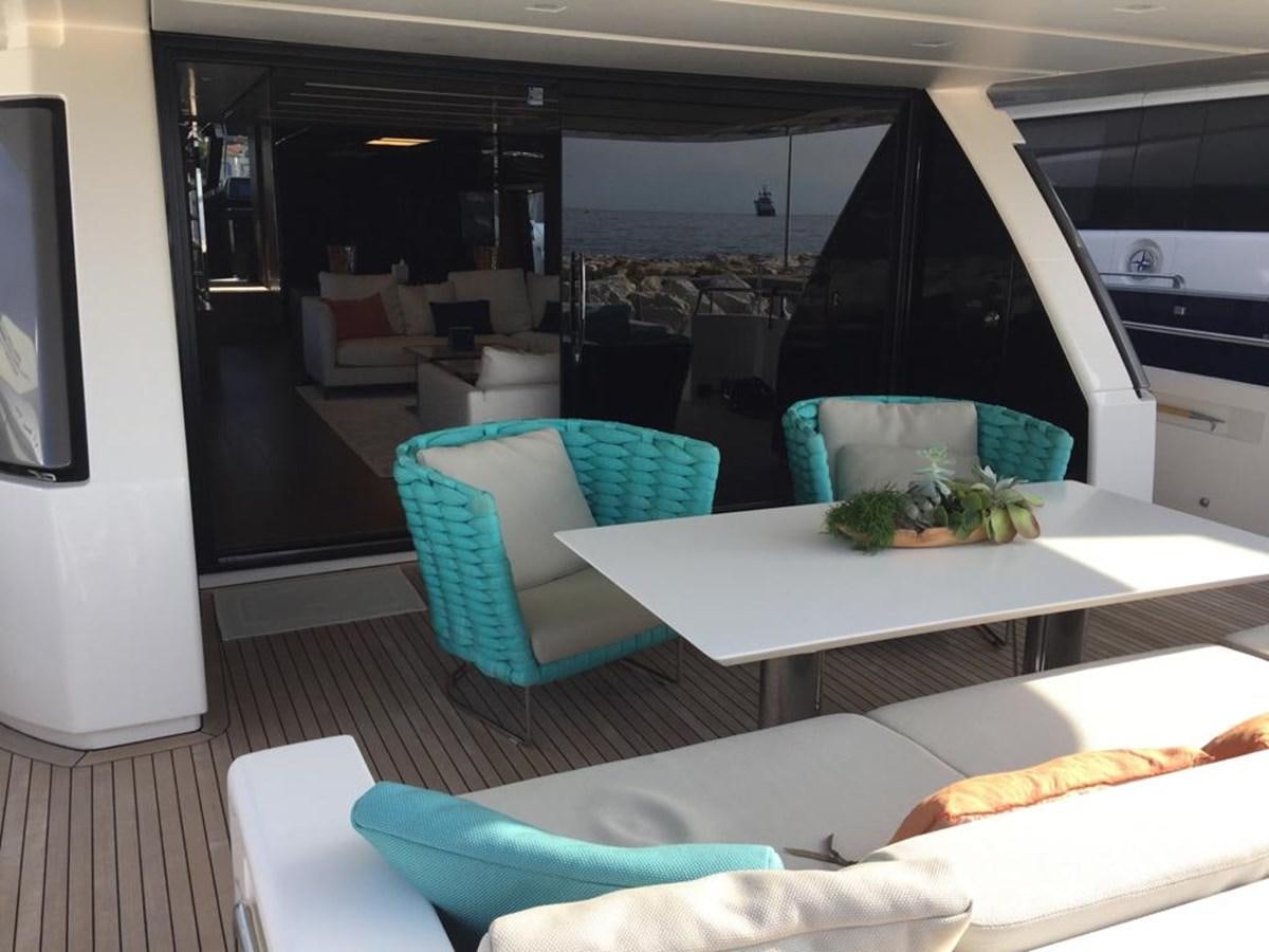 a room with a table and chairs aboard TAIJI Yacht for Sale