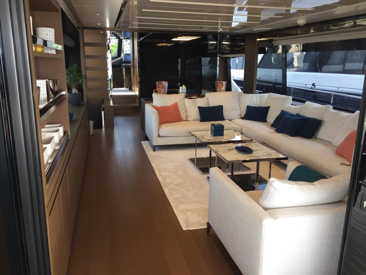 a room with a couch and a table aboard TAIJI Yacht for Sale