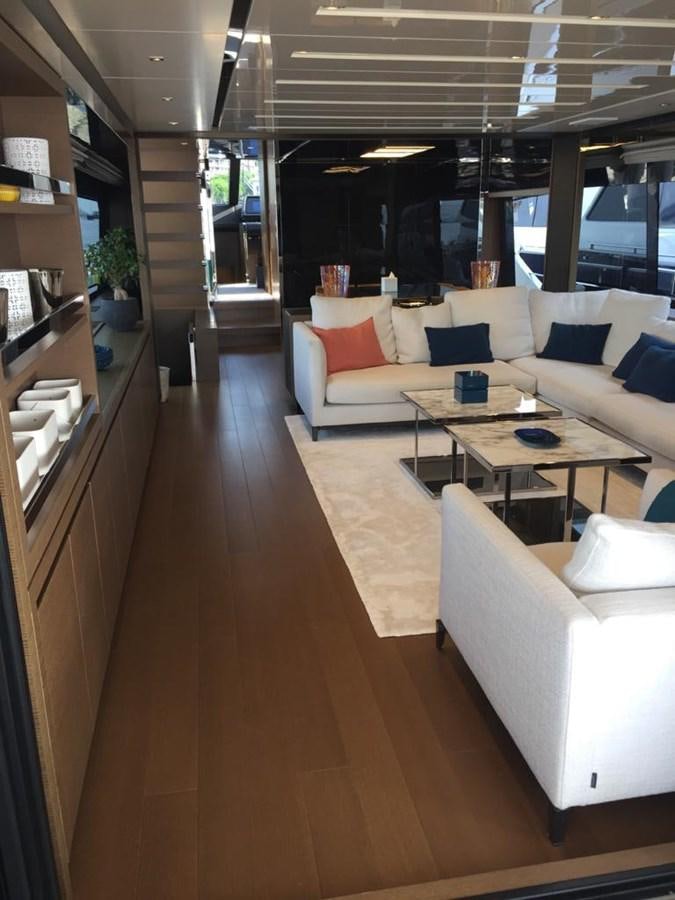 a room with a couch and a table aboard TAIJI Yacht for Sale