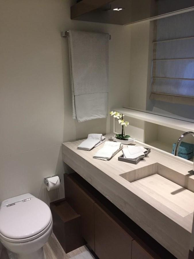 a bathroom with a sink and toilet aboard TAIJI Yacht for Sale