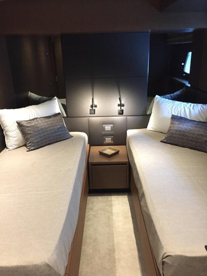 a room with a bed and a desk aboard TAIJI Yacht for Sale