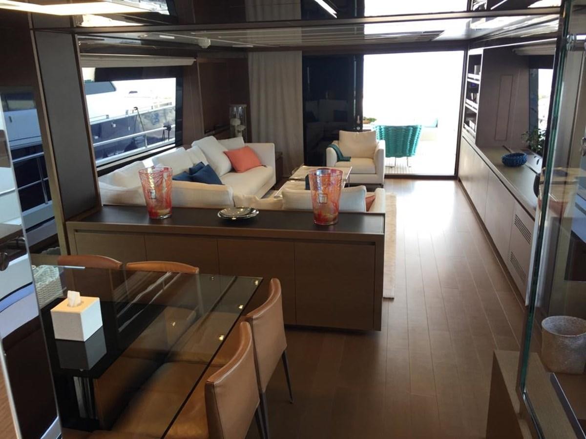 a room with a table and chairs aboard TAIJI Yacht for Sale