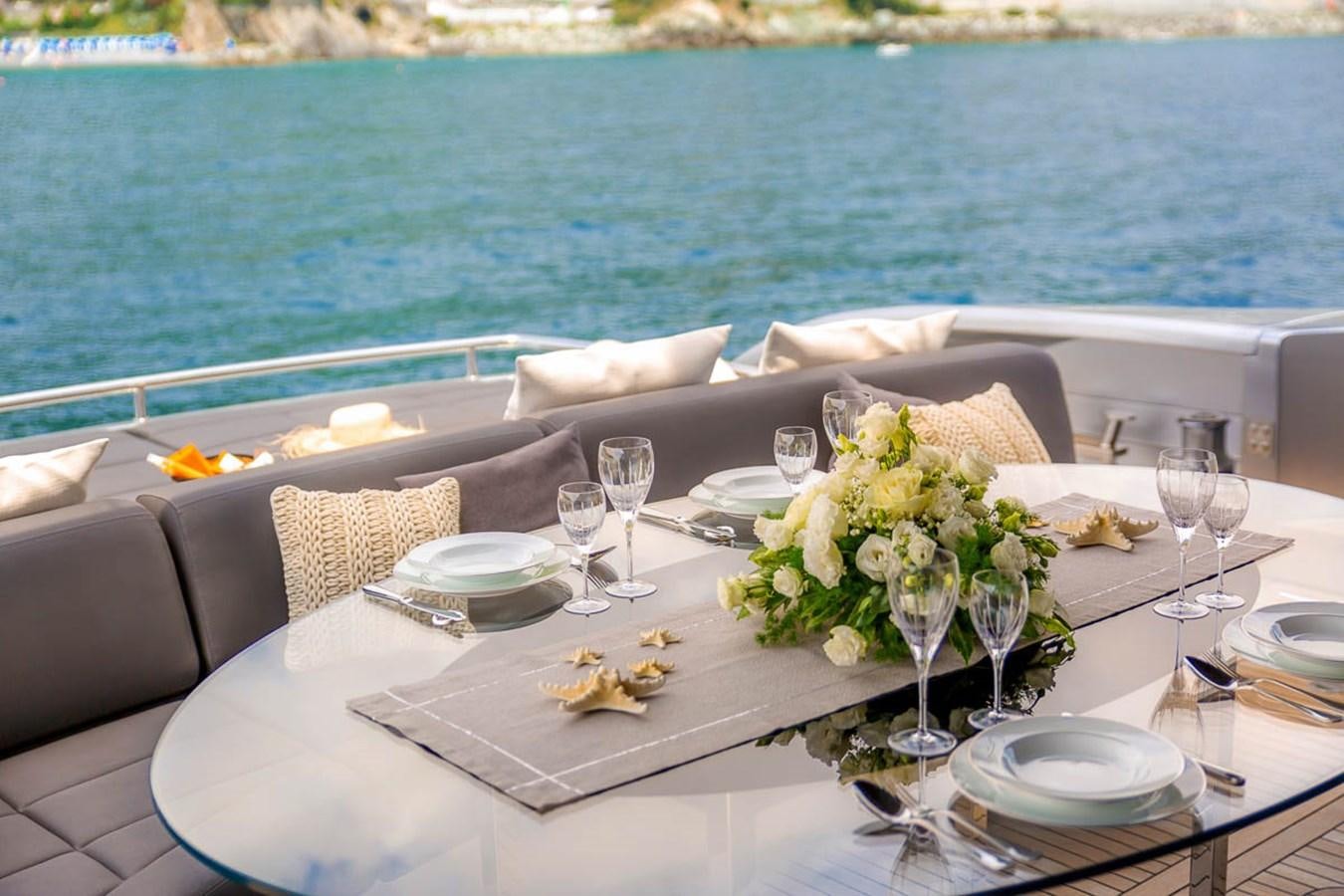 a table set for a dinner aboard X-TREM II Yacht for Sale