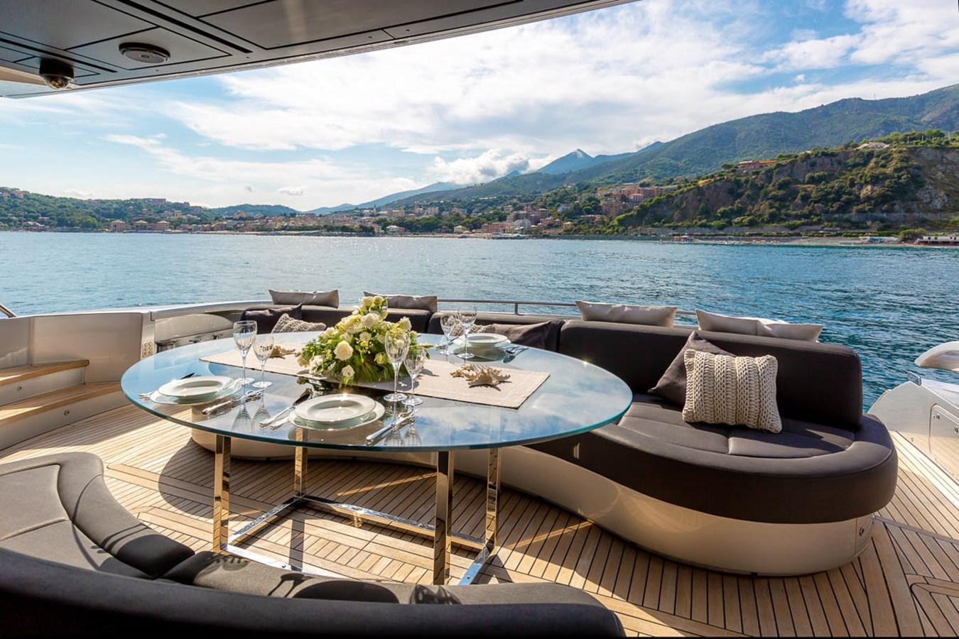 a table set for a dinner on a boat aboard X-TREM II Yacht for Sale
