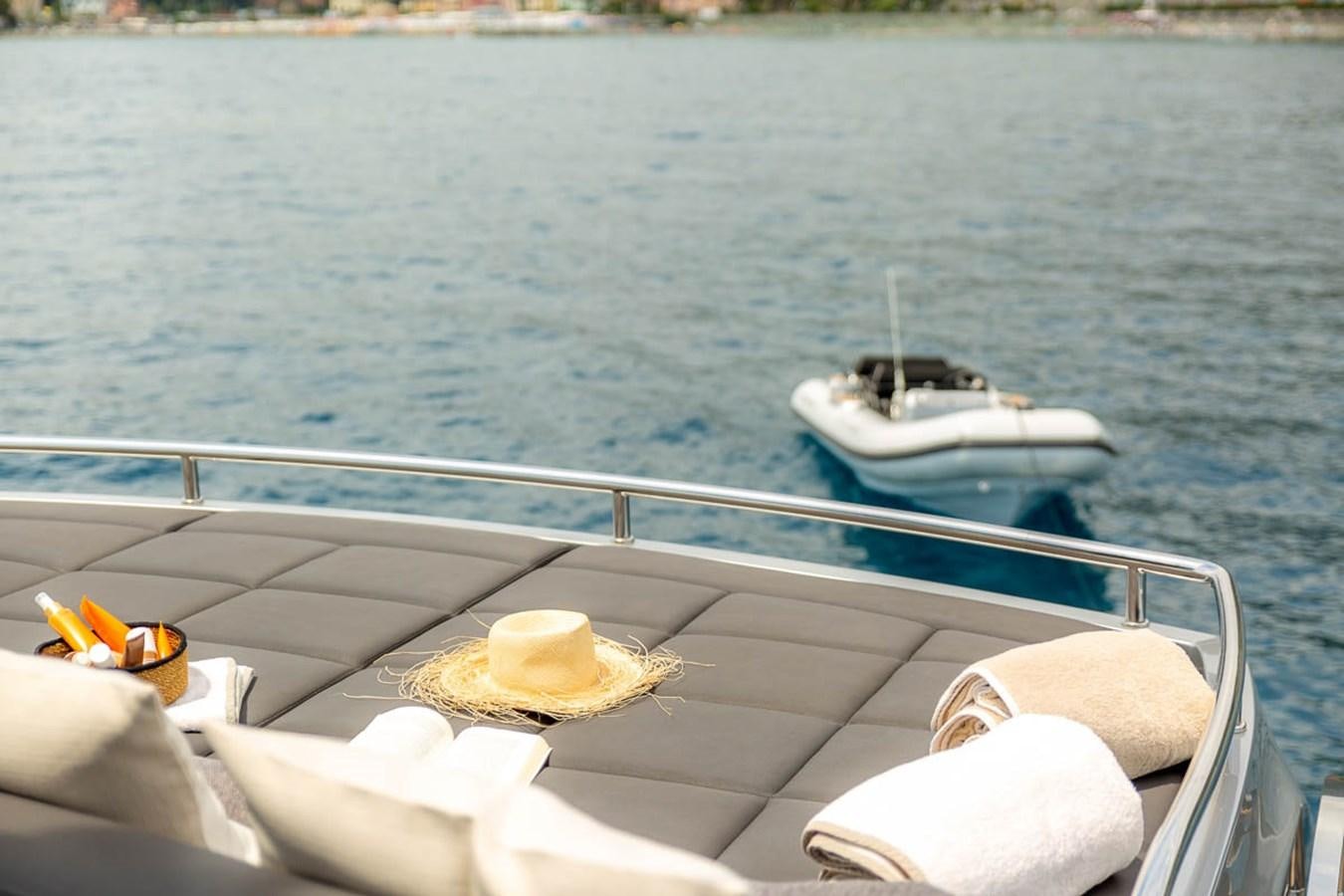 a boat with a hat on it aboard X-TREM II Yacht for Sale