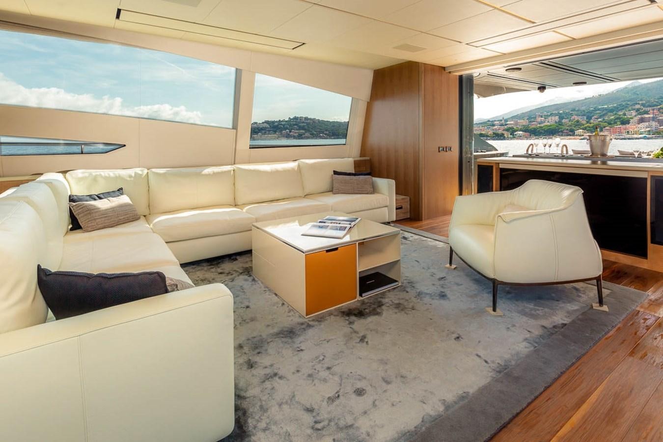 a living room with a large window aboard X-TREM II Yacht for Sale