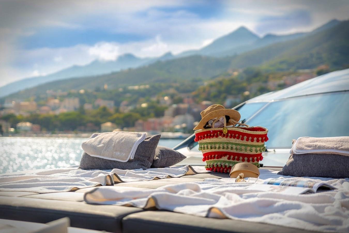 a boat with a straw hat on it aboard X-TREM II Yacht for Sale