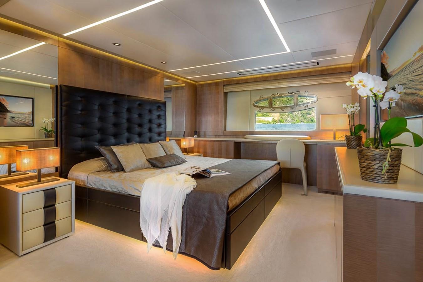 a large bedroom with a large bed aboard X-TREM II Yacht for Sale