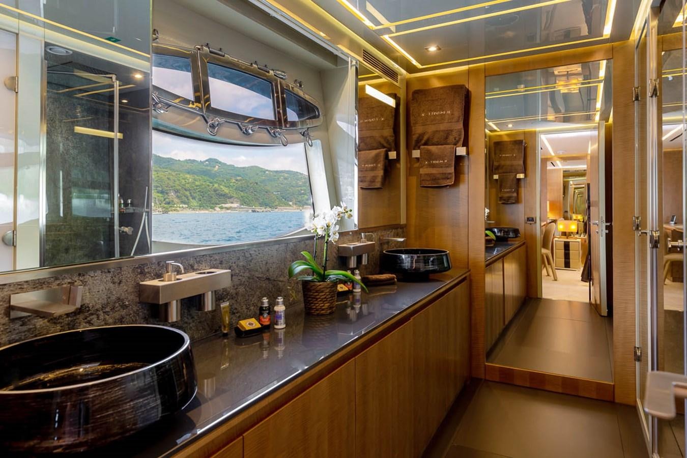a kitchen with a large window aboard X-TREM II Yacht for Sale
