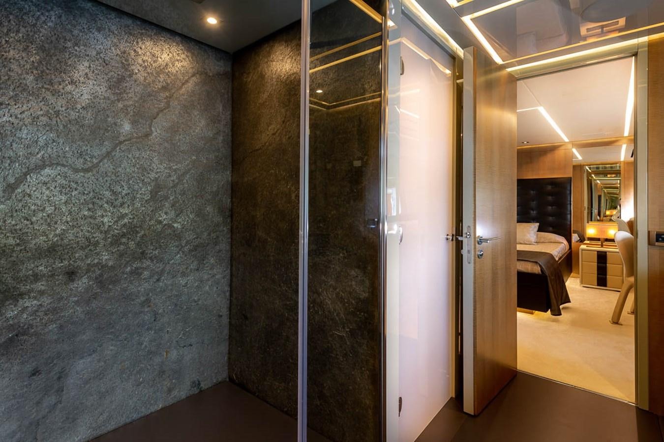 a room with a glass wall aboard X-TREM II Yacht for Sale