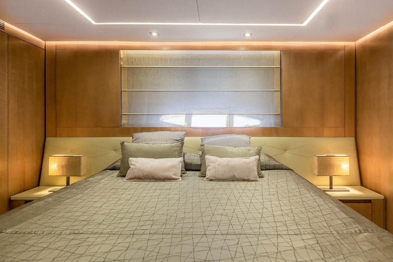 a bed with pillows aboard X-TREM II Yacht for Sale