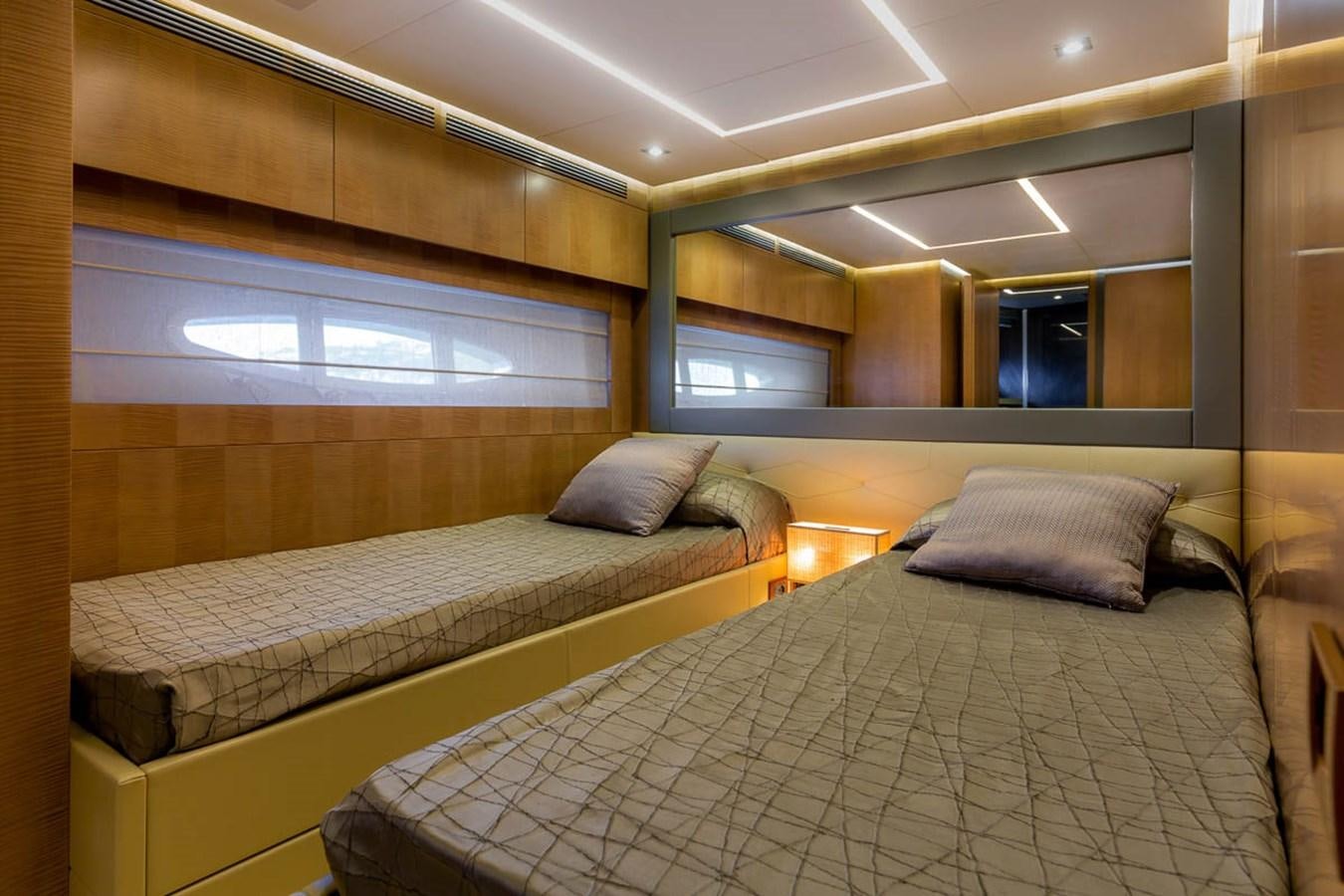 a room with two beds aboard X-TREM II Yacht for Sale