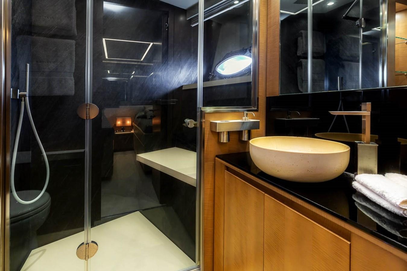a bathroom with a sink and a mirror aboard X-TREM II Yacht for Sale