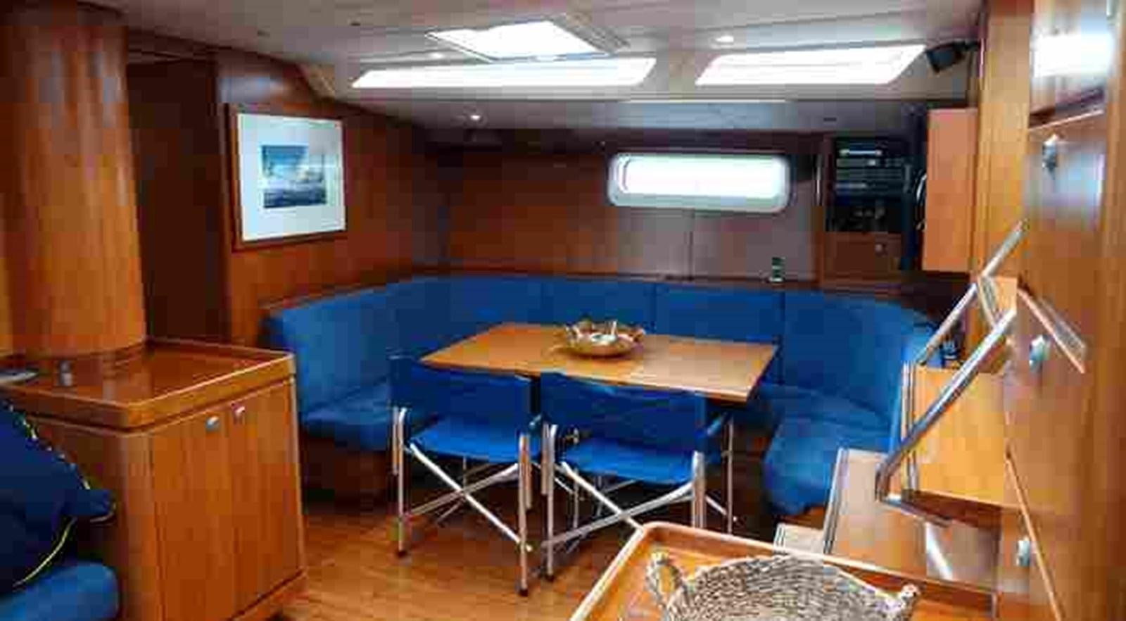 a room with a table and chairs aboard FIFTY FIFTY Yacht for Sale