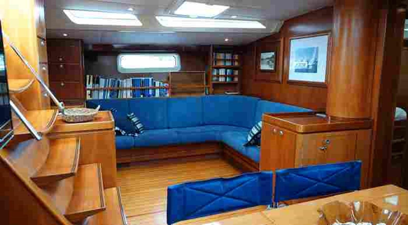 a room with a couch and a table aboard FIFTY FIFTY Yacht for Sale