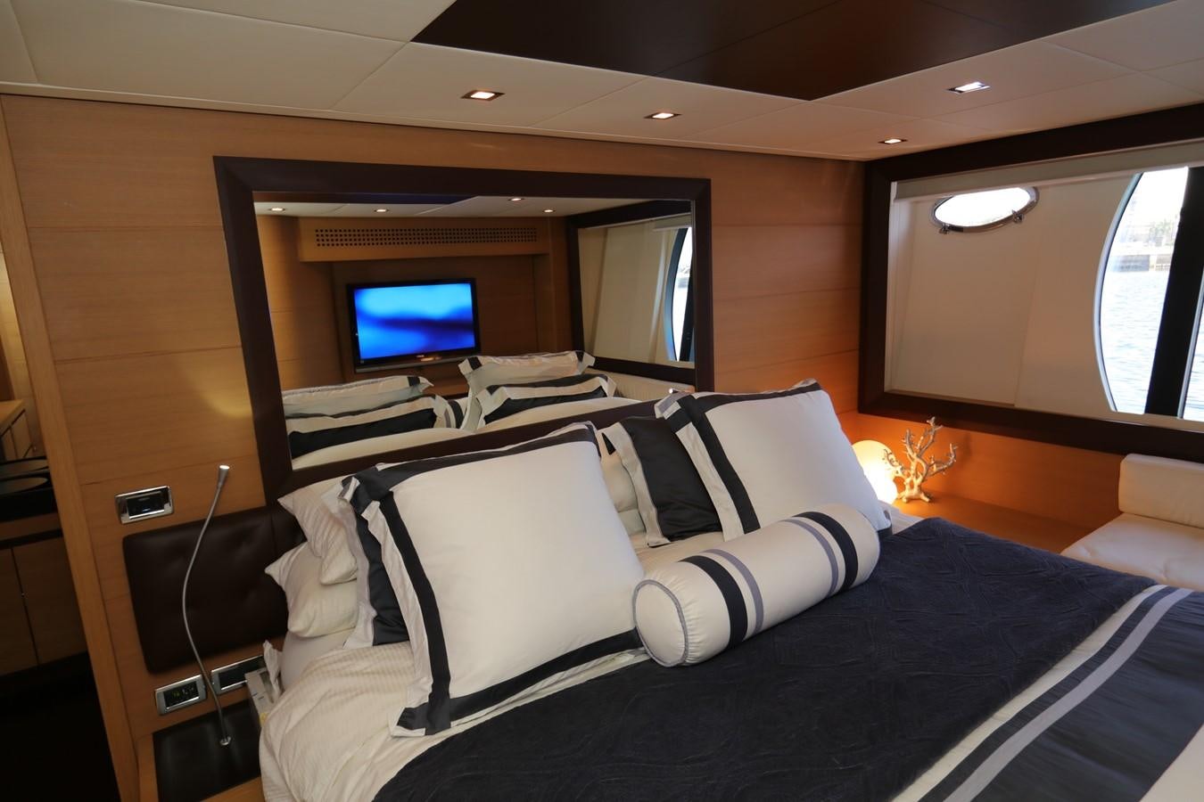 a room with a bed and a tv aboard VANTAGE Yacht for Sale