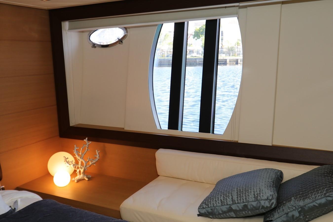 a room with a couch and a window aboard VANTAGE Yacht for Sale