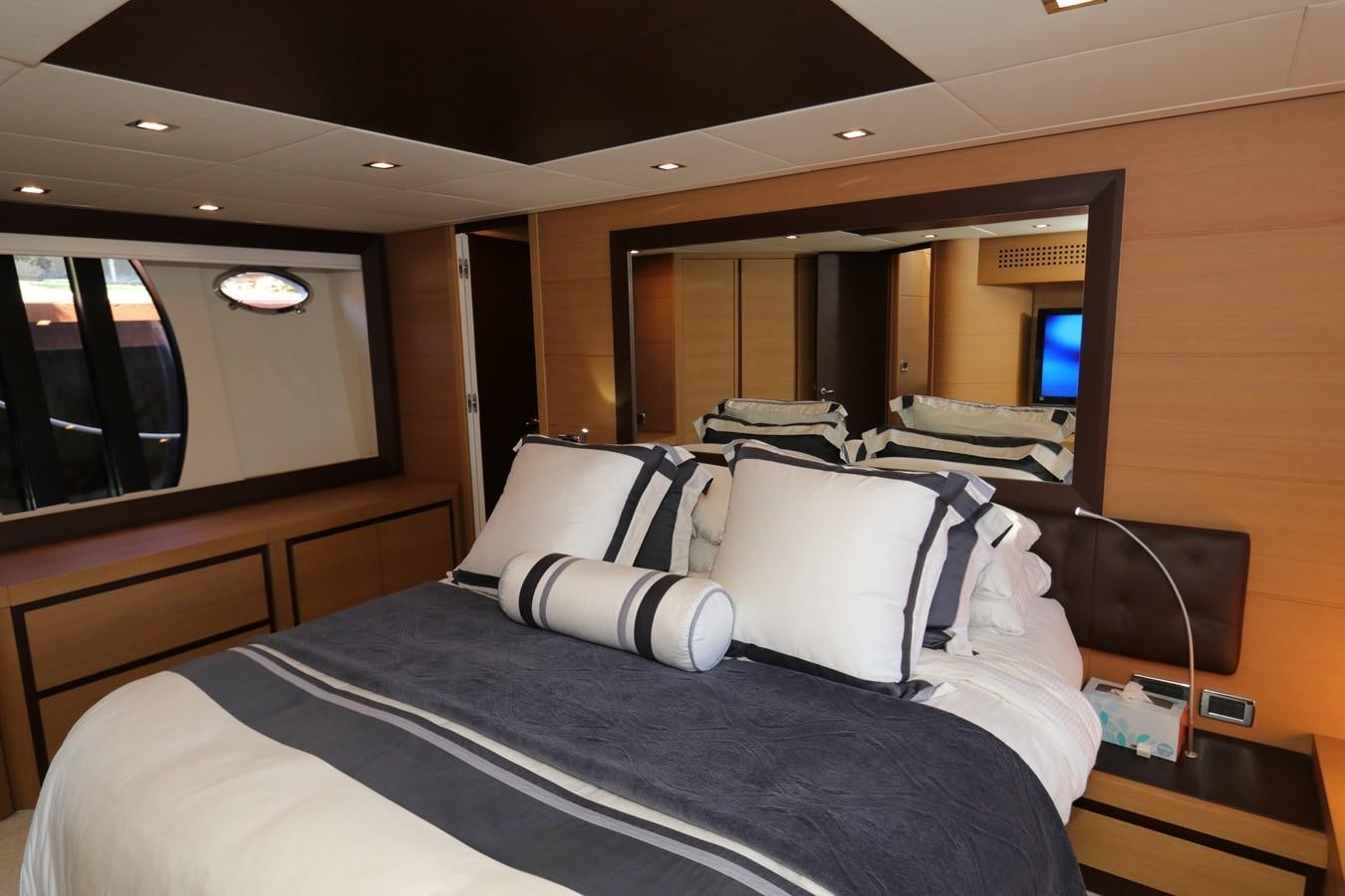 a bed with white pillows aboard VANTAGE Yacht for Sale