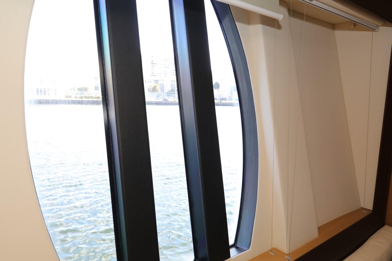a window with a view of a body of water aboard VANTAGE Yacht for Sale