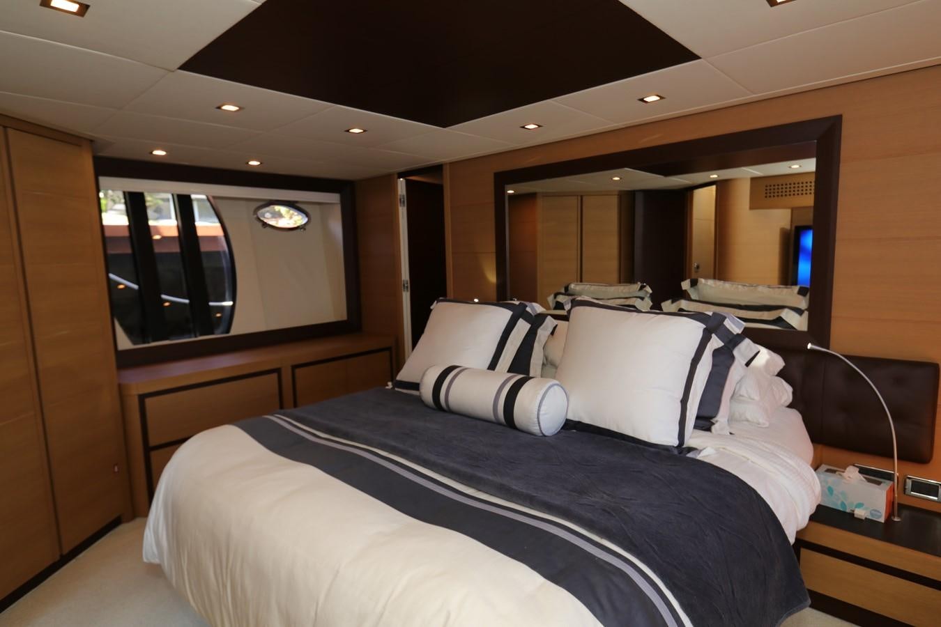 a bed with white sheets aboard VANTAGE Yacht for Sale