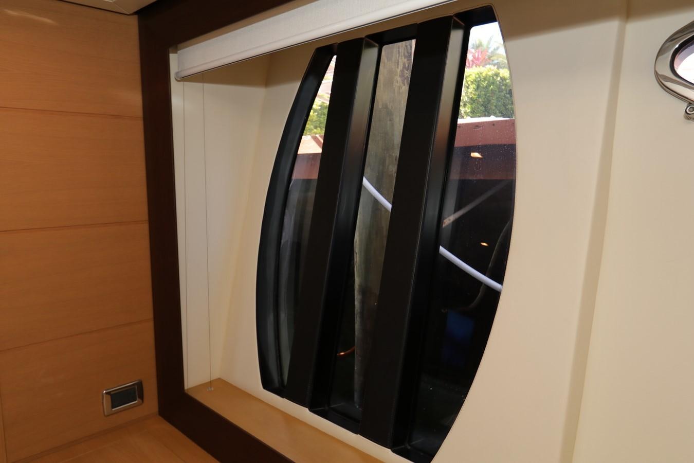 a black cabinet with glass doors aboard VANTAGE Yacht for Sale