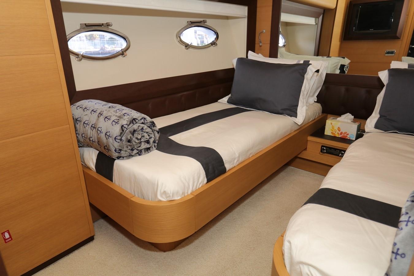 a room with a bed and a mirror aboard VANTAGE Yacht for Sale