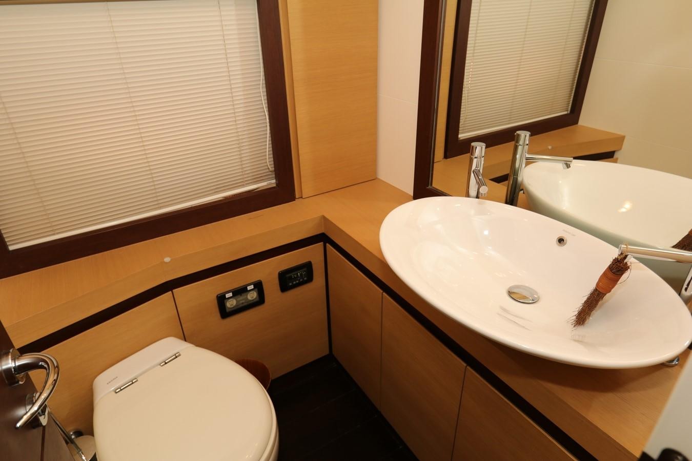 a bathroom with a sink and a toilet aboard VANTAGE Yacht for Sale