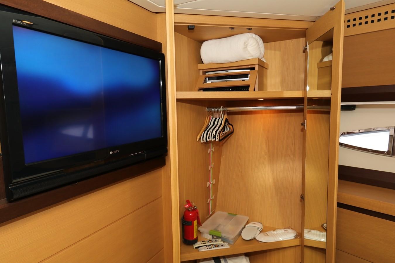 a tv on a shelf aboard VANTAGE Yacht for Sale