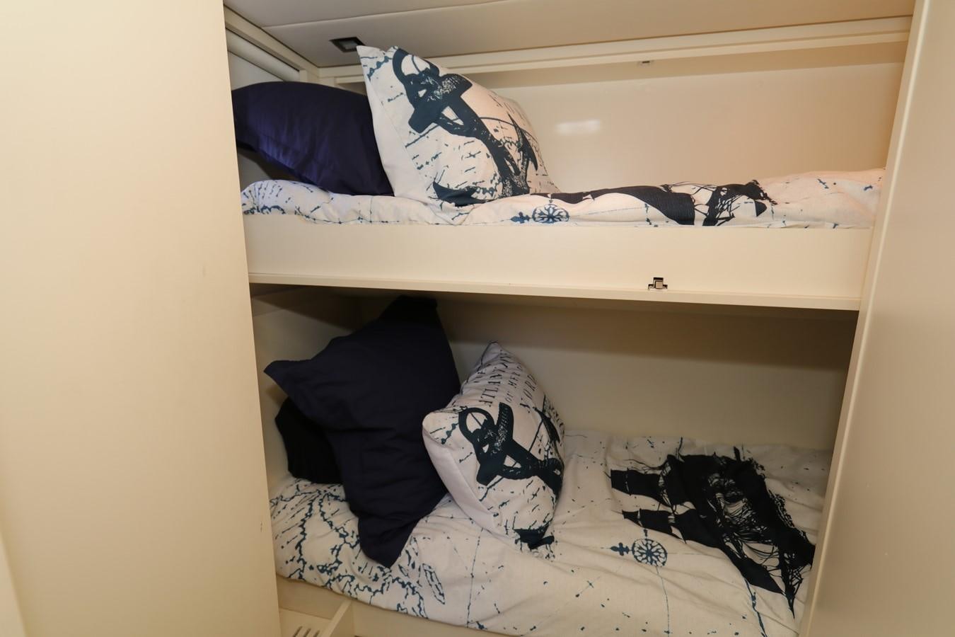 a closet with clothes on it aboard VANTAGE Yacht for Sale