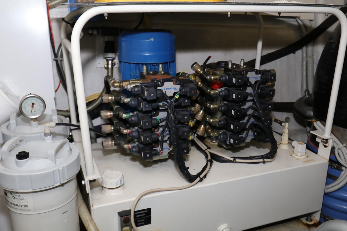 a machine with wires and a blue container aboard VANTAGE Yacht for Sale