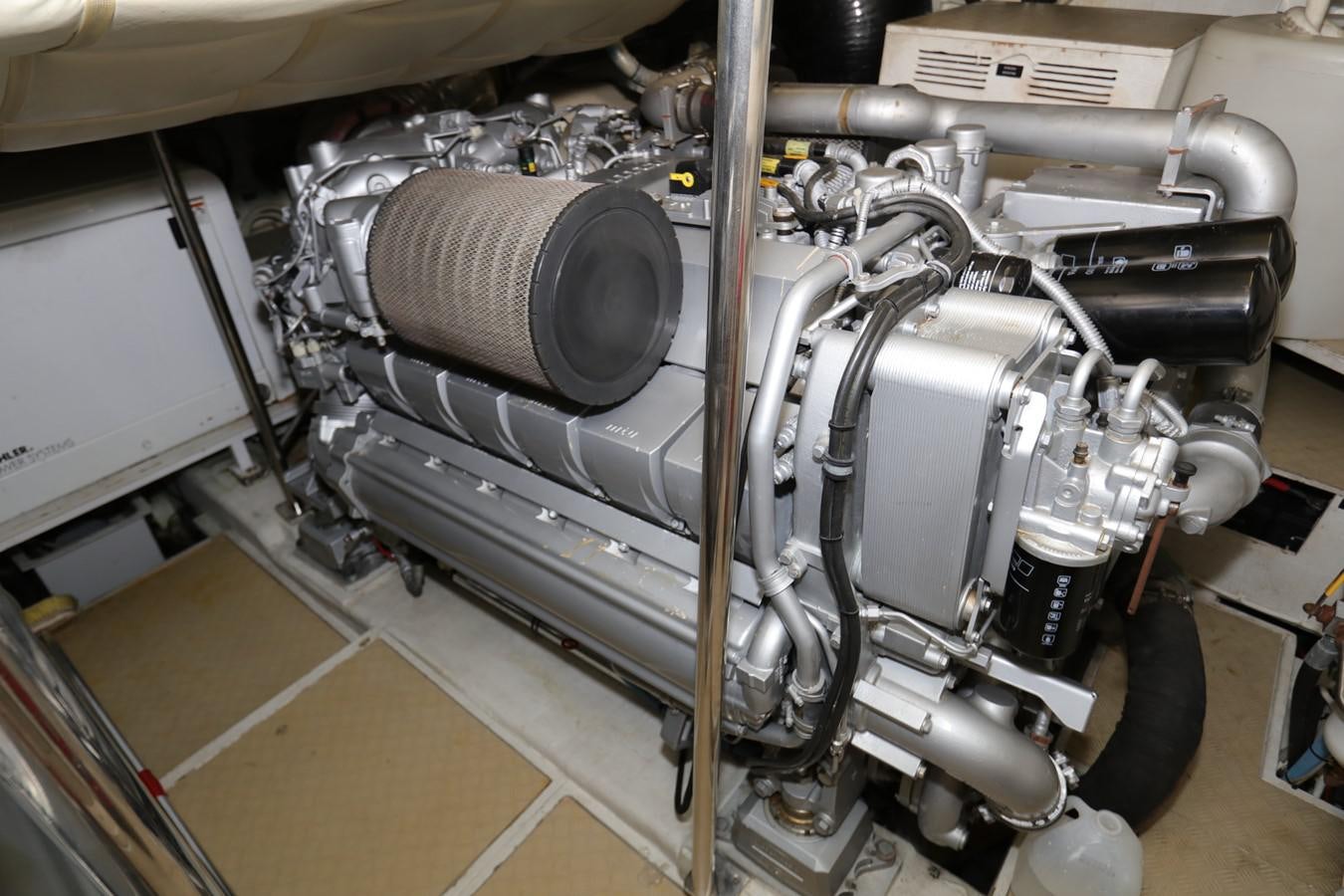 a machine with a large metal cylinder aboard VANTAGE Yacht for Sale