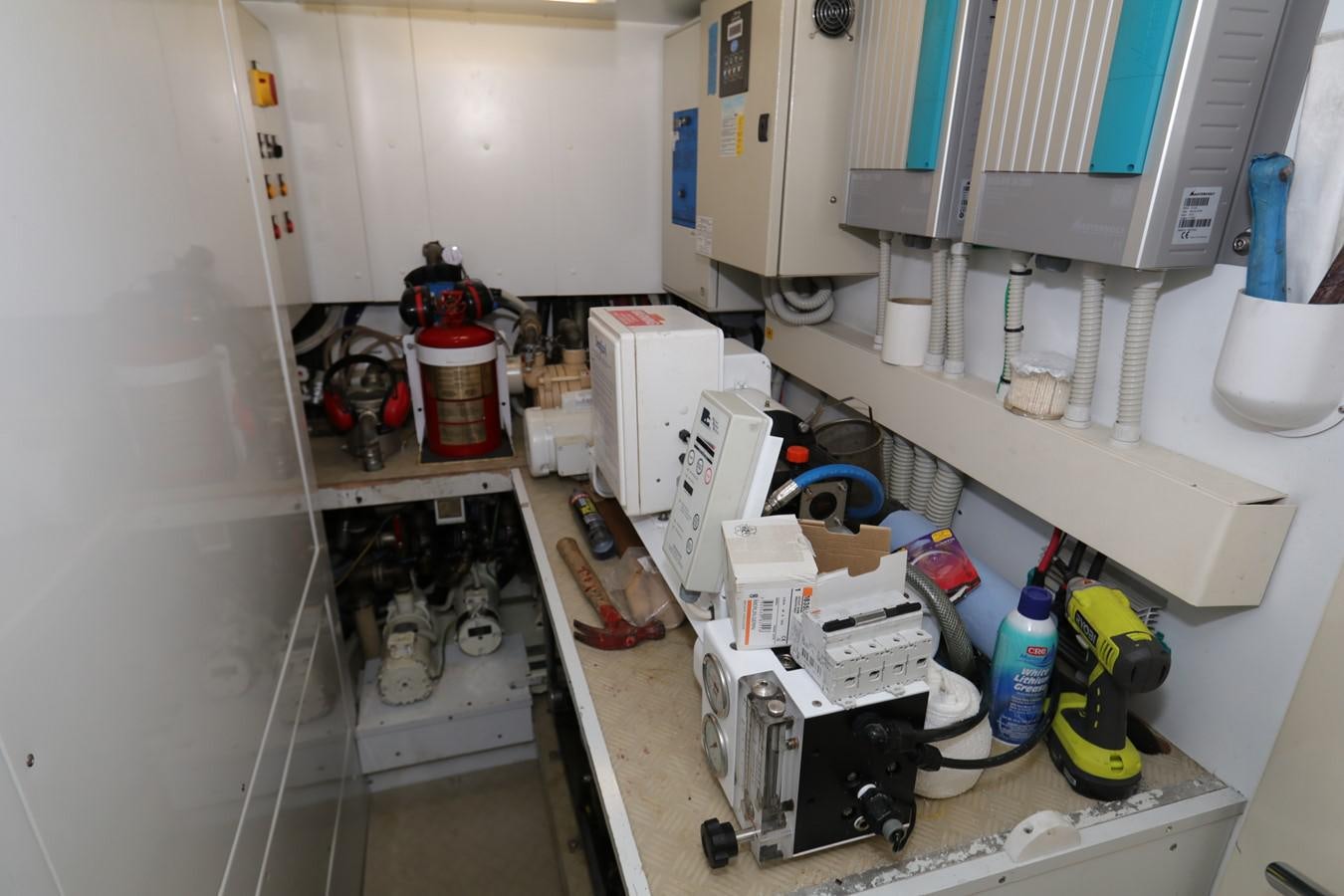 a white room with a lot of clutter aboard VANTAGE Yacht for Sale