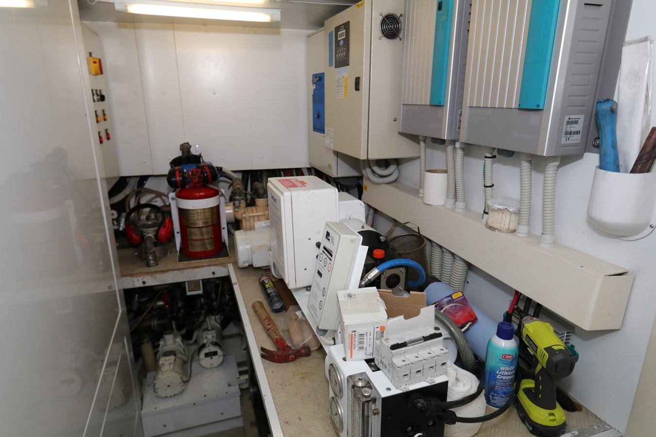 a room with shelves and equipment aboard VANTAGE Yacht for Sale