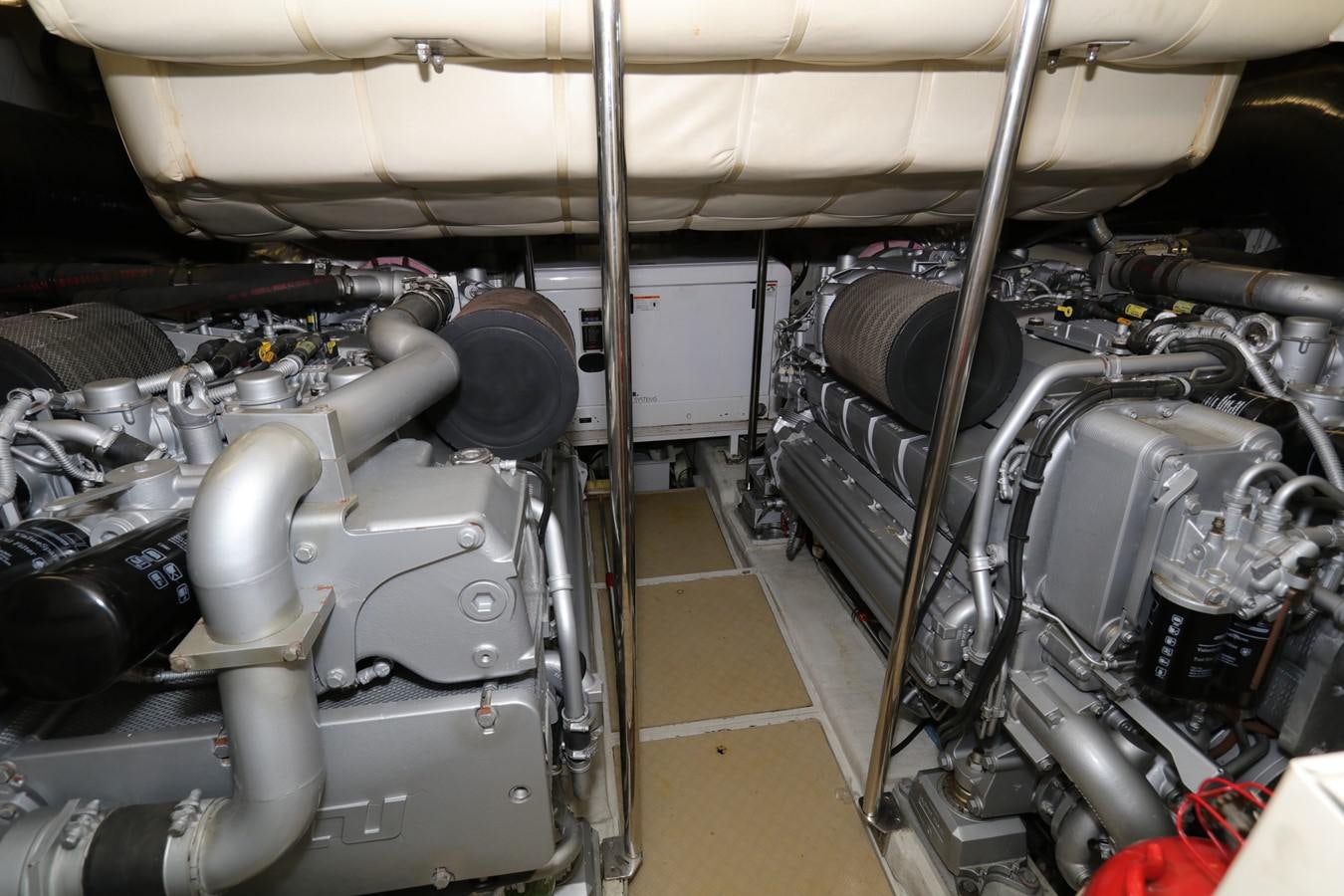 a car engine with a large pipe aboard VANTAGE Yacht for Sale