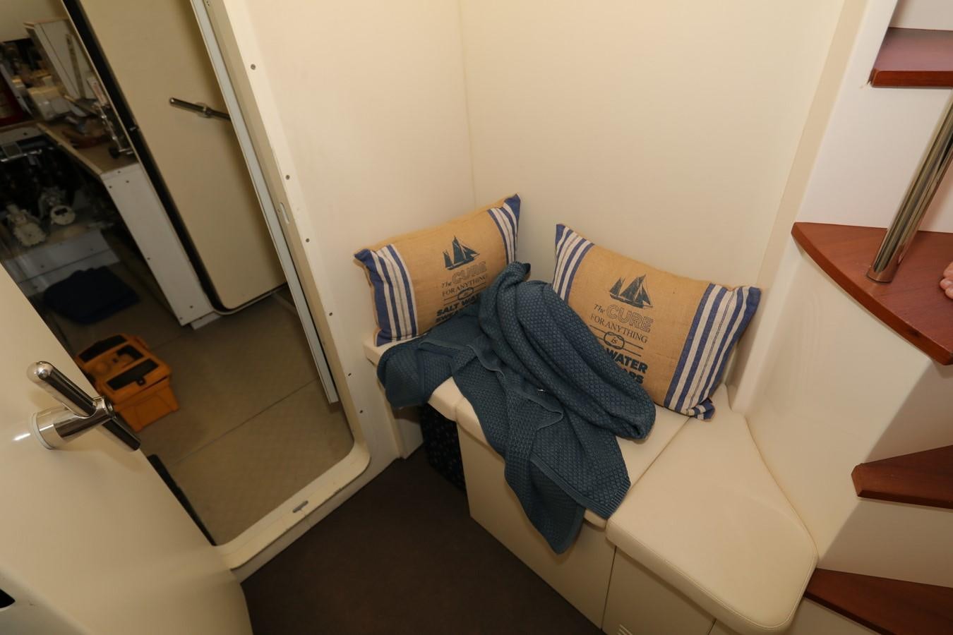 a room with a chair and a table aboard VANTAGE Yacht for Sale