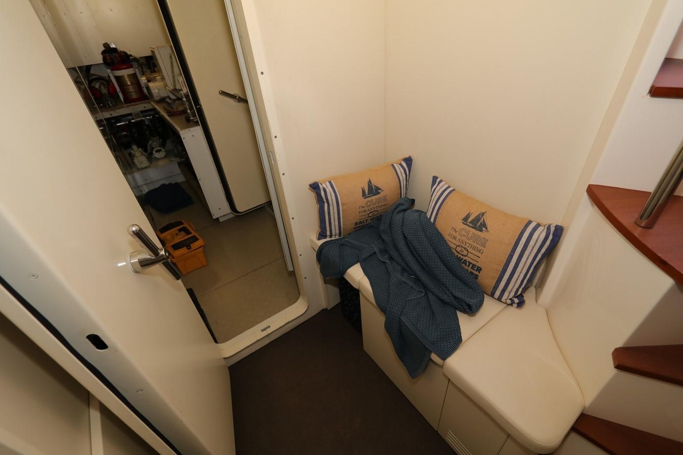 a room with a bed and a mirror aboard VANTAGE Yacht for Sale