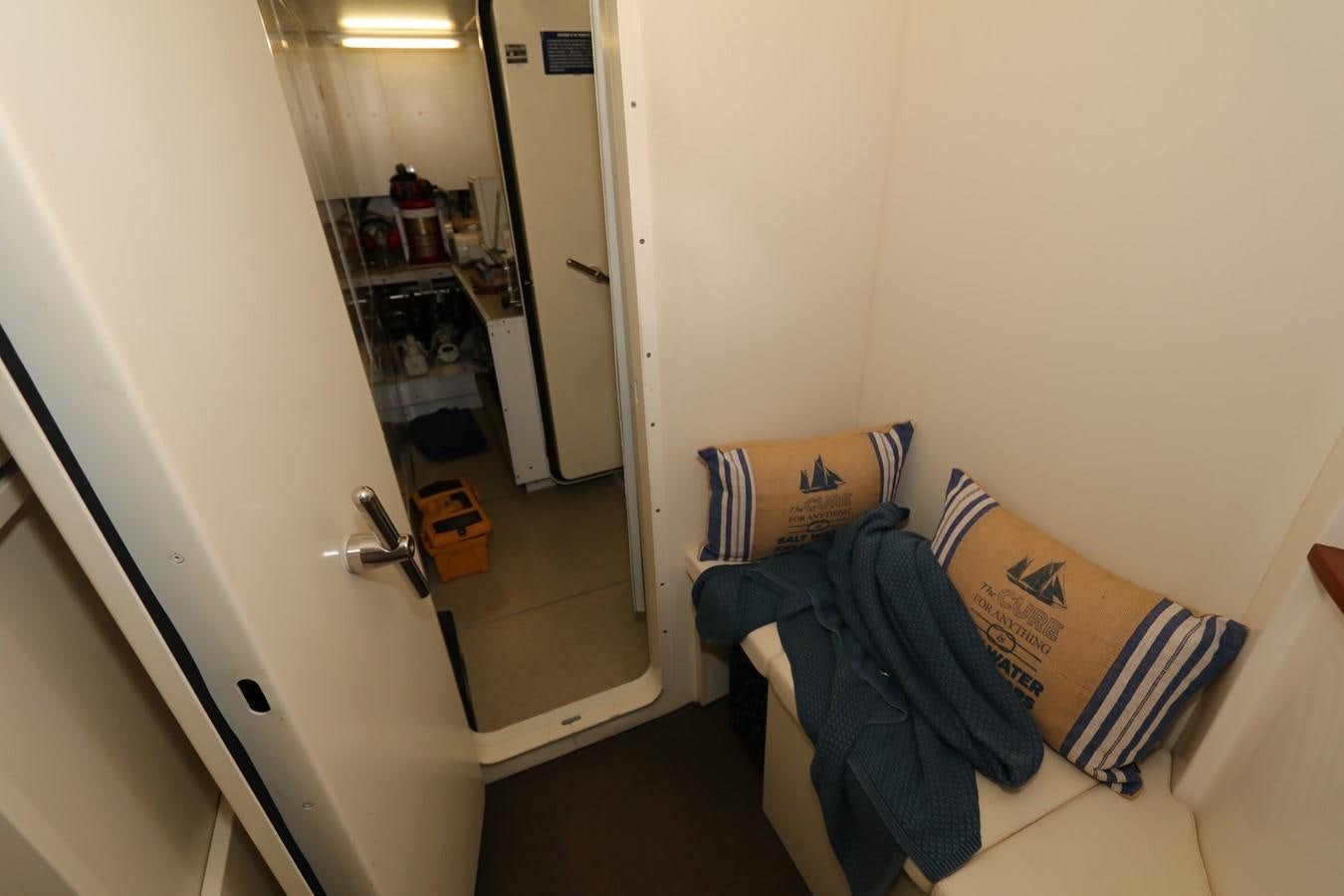 a room with a mirror and a bed aboard VANTAGE Yacht for Sale