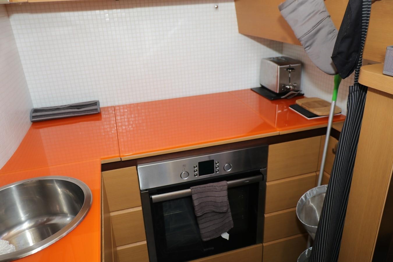 a kitchen with a microwave oven aboard VANTAGE Yacht for Sale