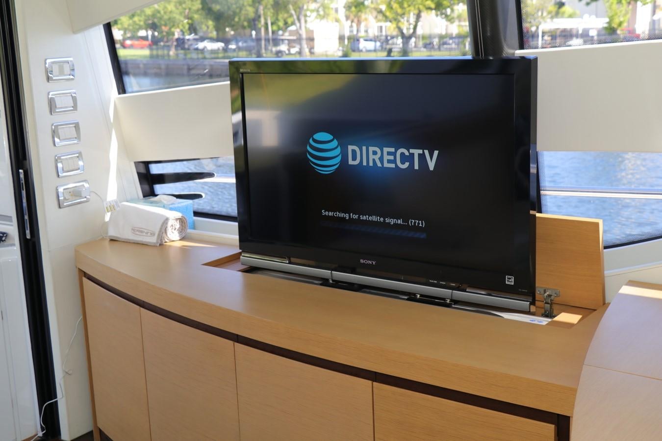 a computer on a desk aboard VANTAGE Yacht for Sale