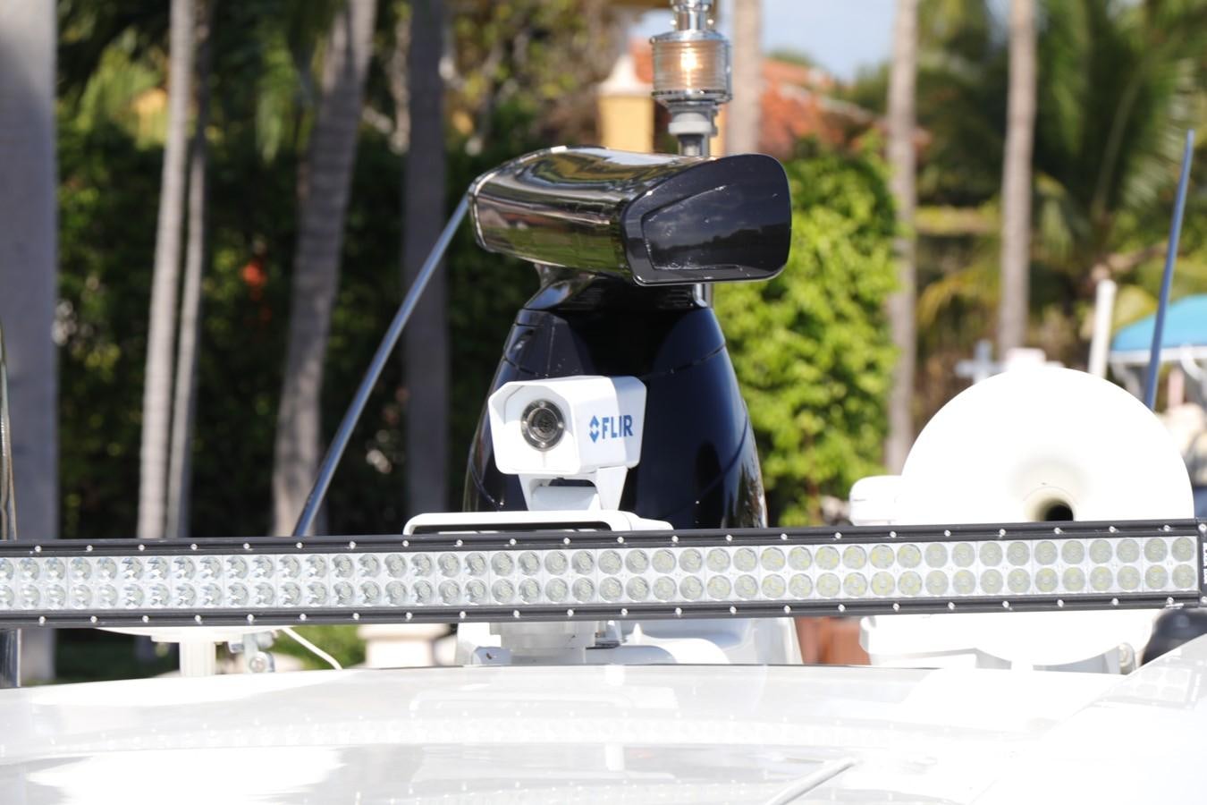 a person wearing a helmet and holding a bike aboard VANTAGE Yacht for Sale